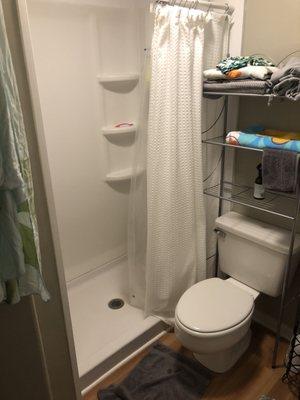 Foot towel and shower curtain were left in this fashion. (Towel was nearly folded and curtain closed prior to inspection.)