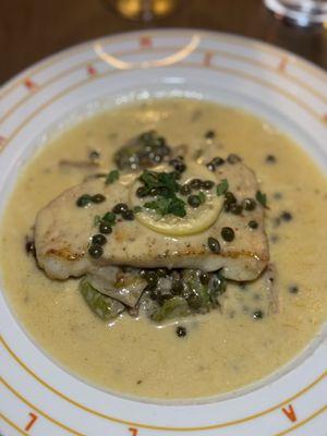 Chilean Sea Bass with capers in a lemon. S butter sauce.