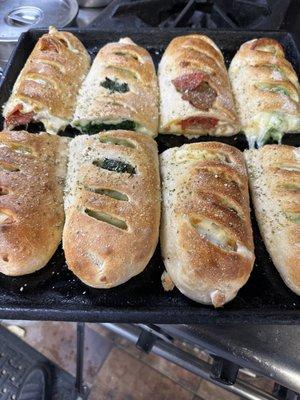 Spinach, pepperoni, chicken Strombolis