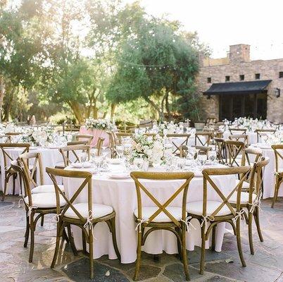 Our classic Wooden Vineyard Crossback chairs with white round tables