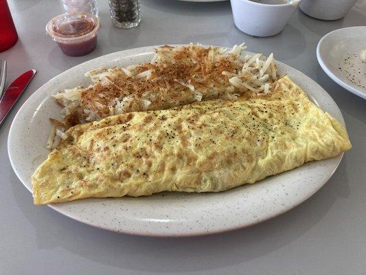 Western omelet loaded with ham, cheese, onions, and bell peppers