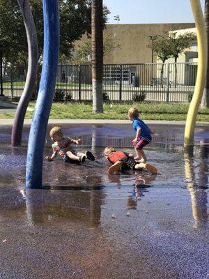 Kids having fun on splash pad.