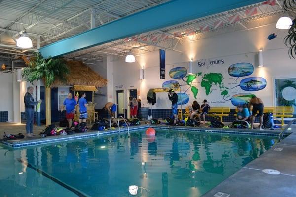 A scuba class preparing to get in our pool.