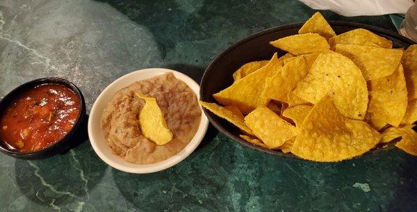 Complementary chips, baked beans and salsa