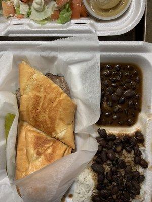 The French Dip Sandwich with rice and beans.