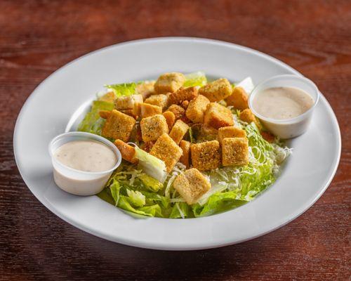 Caesar Salad: romaine, Parmesan, and croutons.