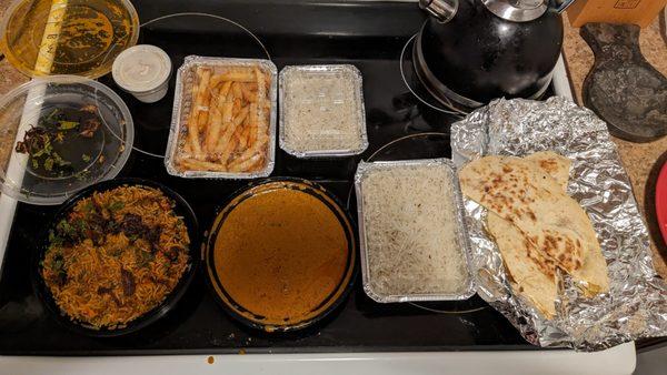 From left to right: Lamb Biryani, Marsala Fries, Lamb Butter Masala Curry, Plain Naan