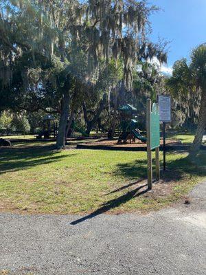 Playground shaded by trees