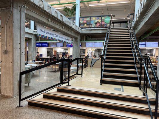 Two floors of cafe seating with bright skylight