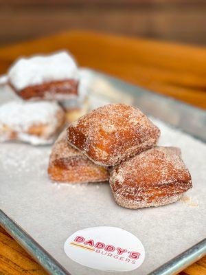 Beignets available with powdered sugar or cinnamon sugar.