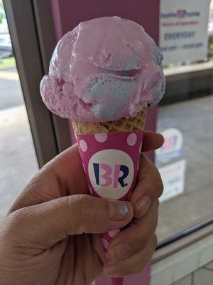 Cotton candy ice cream in a sugar cone