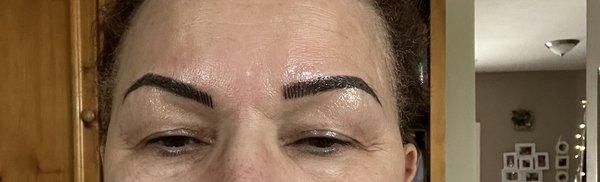 microblading - one side is higher than the other.