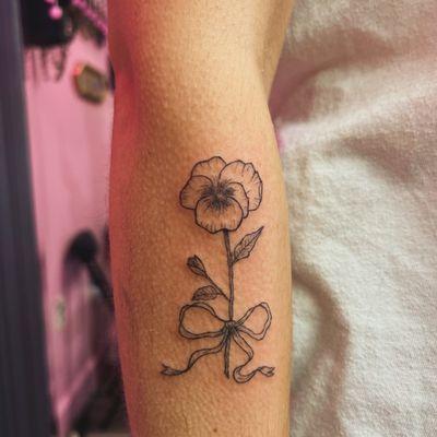 Delicate violet tattoo