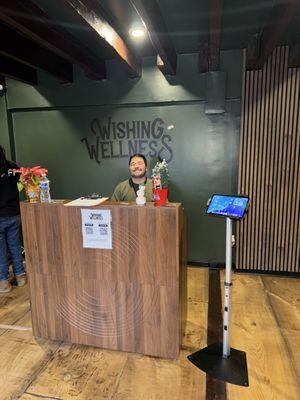 Welcoming check-in area at Wishing Wellness DC, where our friendly staff ensures a smooth start to your personalized dispensary experience.