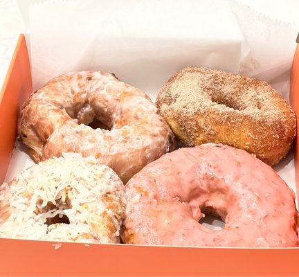 Clockwise from top left - glazed, cinnamon sugar, strawberry milk, coconut