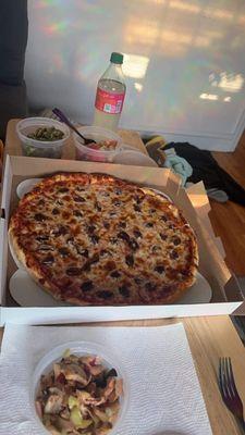 Kalamata olive pizza, snail salad, tomato and cucumber salad and pesto tortellini.