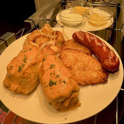 Polish Plate includes stuffed cabbage, two potato pancakes, six potato & cheese pierogies, and a polish sausage