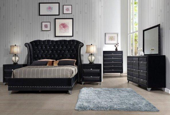 Velvet black tufted bed