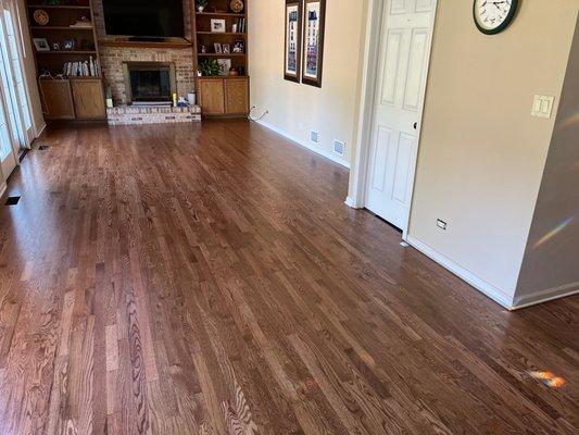 Floor by fireplace was carpet, up to door on the right. Carpet was removed, flooring weaved with existing floor.