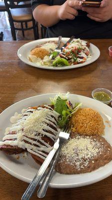 Enchilada Dinner Plate with Rice, beans, and salad.