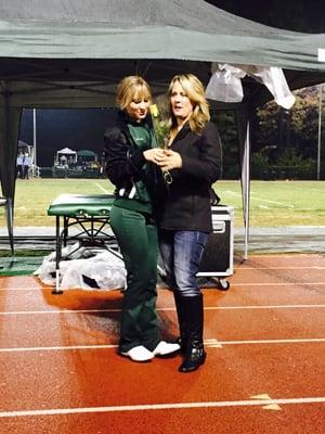 Cheerleader giving fullers rose to her mom on senior night at PHS