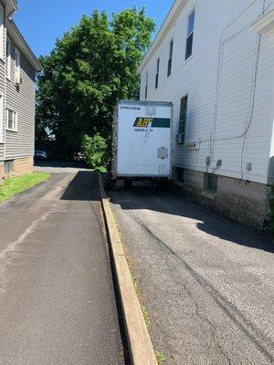 Fork lift bringing the relocube through my narrow driveway to the spacious parking lot