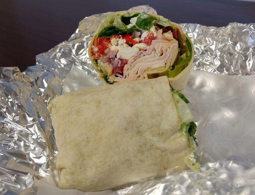 Turkey Mediterranean Wrap: smoked turkey, feta, artichoke hearts, roasted red peppers, red onion, tomato, spinach & sundried tomato pesto.