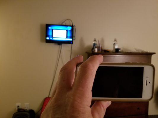 8 feet away, this 17 inch TV with wires running to and fro, is an insult. My phone has a larger image when held in front of me. Not classy.