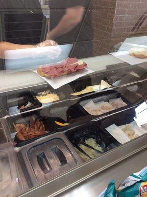 Making the Rueben. They have their "local favorite Rye bread", a light colored  bread.