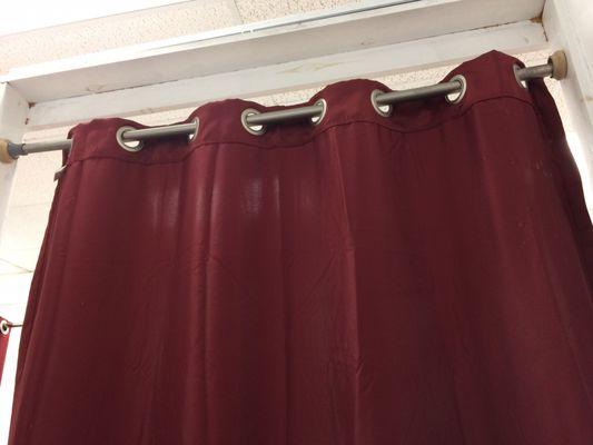 The dressing room curtain didn't fully cover the opening.