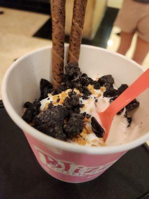 Coconut and cheesecake froyp with almonds, oreos, and chocolate cookie straws.