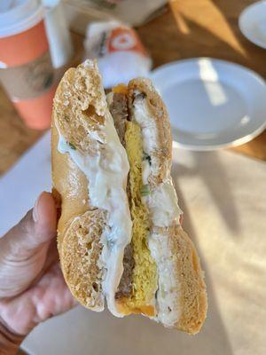 Inside the jalapeño cheddar sausage egg scallion cream cheese sandwich