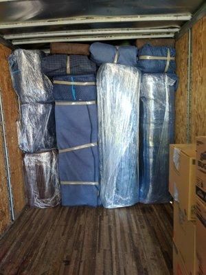 Wrapped in pads and stacked securely. Our movers are damage free experts