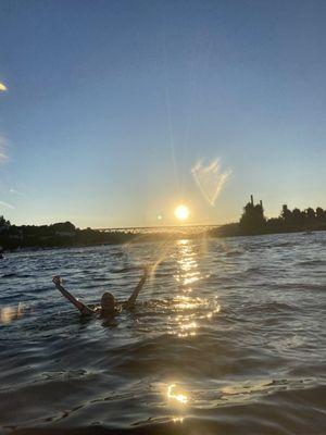 Hopping out & swimming around in Lake Union with Gas Works & sunset in the background