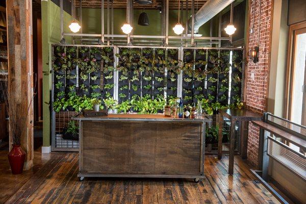 A mobile bar and moveable living wall makes the Revel Revel space totally customizable.