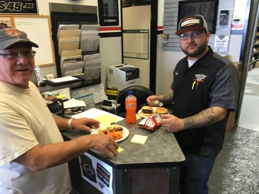 Service Manager-Travis Sneaking a bite to eat