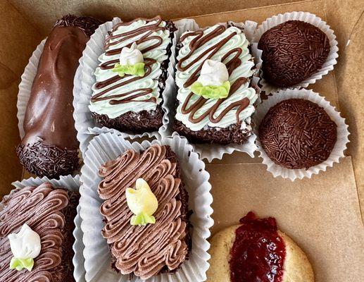 Eclair, chocolate and chocolate mint rum cakes, rum balls, and a raspberry thumbprint cookie