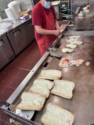 Chef Andres on the grill, working them delicious steak and cheeses.