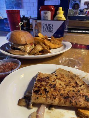 Quesadilla (half, bitten into) and Chicken pesto sandwich and fries