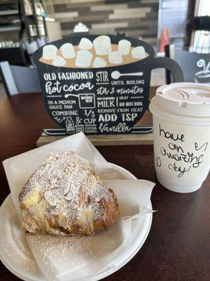 Vanilla latte with coconut milk and almond croissant with vanilla filling