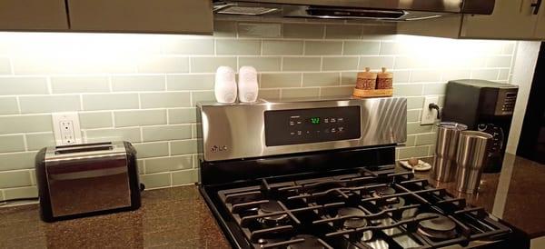 Our new kitchen backsplash.  Each 2x6" tile had to be individually placed.  Kitchen had approximately a dozen outlet cutouts. (1 of 3 walls)