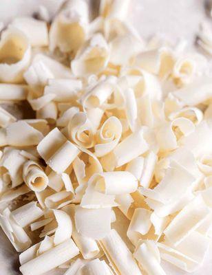 White chocolate shavings (curls). Elfie, this is all your baker had to add to my order to make me, your customer happy.