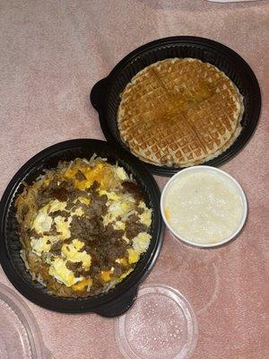 Hash brown Bowl with sausage, Pecan Waffle, and a Bowl of Cheese Grits