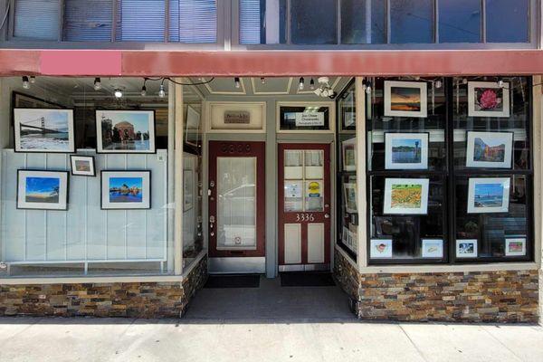 This open art studio features a permanent rotating display of paintings and photographs in its windows.