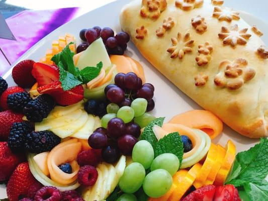 Baked brie en brioche with fresh fruit.