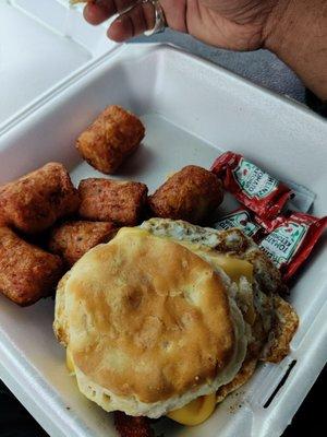 Egg bacon biscuit and loaded tatter tots.