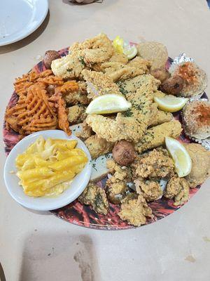 Seafood platter for two with mac and cheese and sweet potato fries.