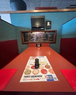 Class booth with intercom to order and train stop for drinks