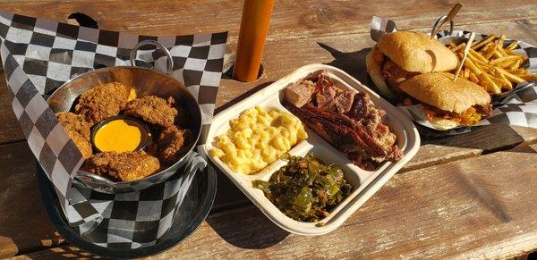 Our spread, from left to right: fried oysters, three meat plate and fried oyster Po boy w fries.