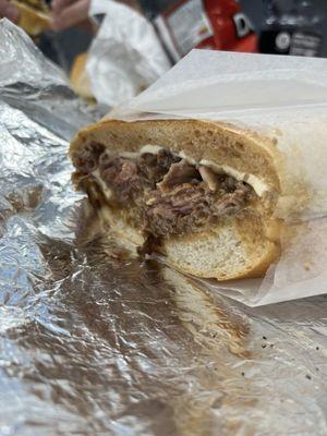 Half of the Shaq sandwich. Hot roast beef with fresh mozzarella and gravy on a hero roll.